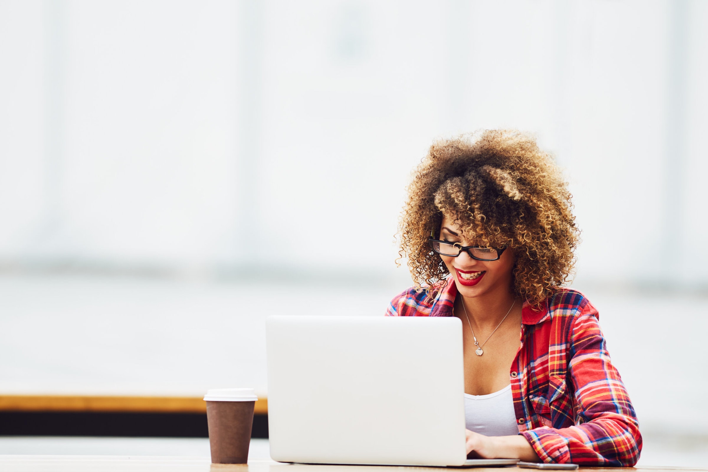 A woman working at a laptop