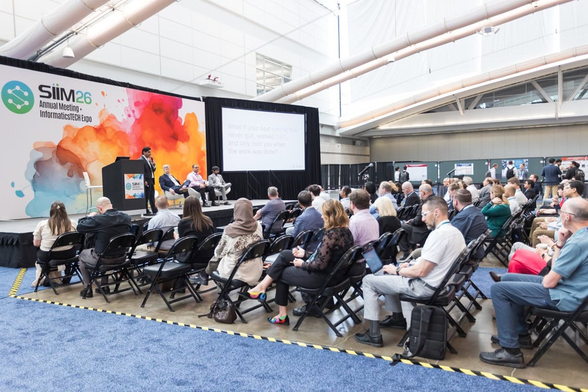 group of people attending a siim26 conference session